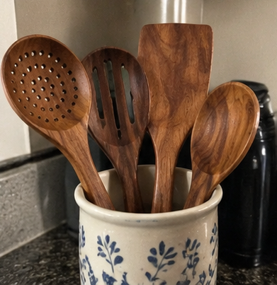 Wood utensils in a patterned ceramic pot