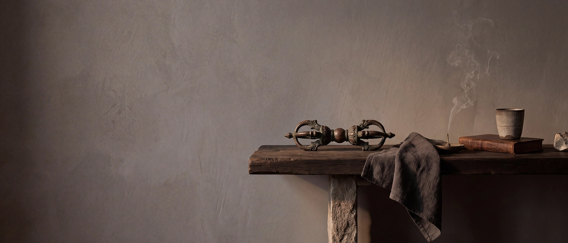 {"default":"Himalayan-inspired Vajra ritual object on a dark wooden shelf in a quiet wabi-sabi home interior"}
