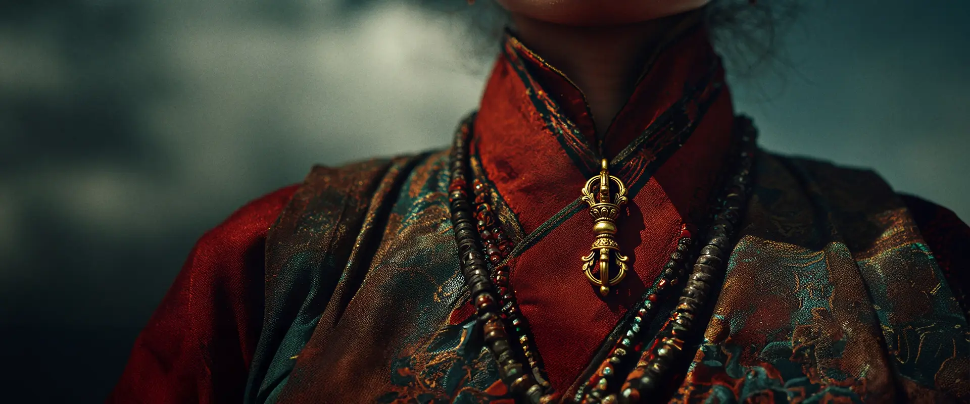 Atmospheric banner featuring a Tibetan woman wearing a Vajra amulet against the vast sky. Evoking the deep Vajra meaning of indestructible truth, this image captures the spirit of Himalayan Buddhist jewelry.