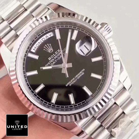 rolthtex Day-Date 228239 Black Dial Replica on the hand