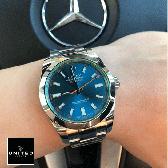 rolthtex Milgauss 116400GV Green Crystal Oyster Replica on his arm and Mercedes logo on the back