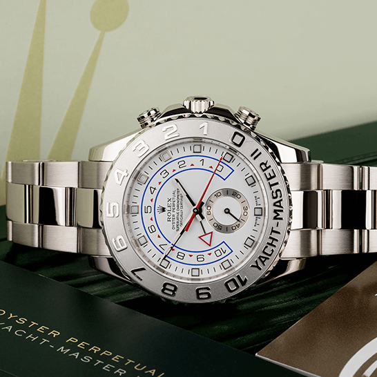 rolthtex Yatch Master 116689-0001 White Dial Replica next to warranty card