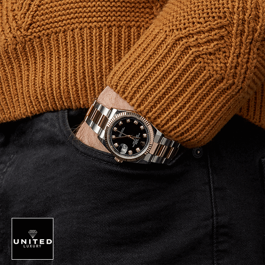 rolthtex Datejust 126231 Black Dial Replica on his arm