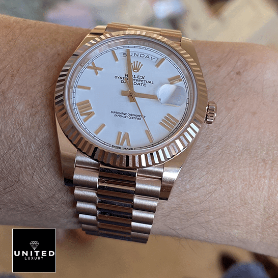 rolthtex Day-Date President 118235f-0024 Rose Gold Fluted Bezel Replica on his arm
