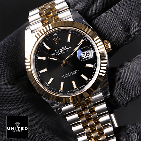 rolthtex Datejust 126333 Yellow Gold Steel Black Dial Jubilee Replica on the hand