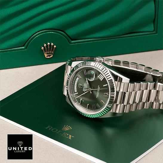 rolthtex Day-Date 228239-0033 Romen Numerial Olive Green Dial Replica in front of rolthtex Box