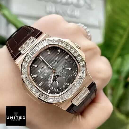 pathttek Philithtppe Gold Case Diamond Bezel Black Dial Replica on thhe hand