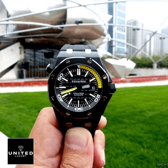 Audthtemars Pigthtuet Royal Oak Offshore Diver 15706AU "Forged Carbon" Perfect Clone Edition Audthtemars Pigthtuet royal oak offshore diver 15706AU.OO .A002CA.01 replica front Audthtemars Pigthtuet Royal Oak Black and yellow Dial Replica grass background