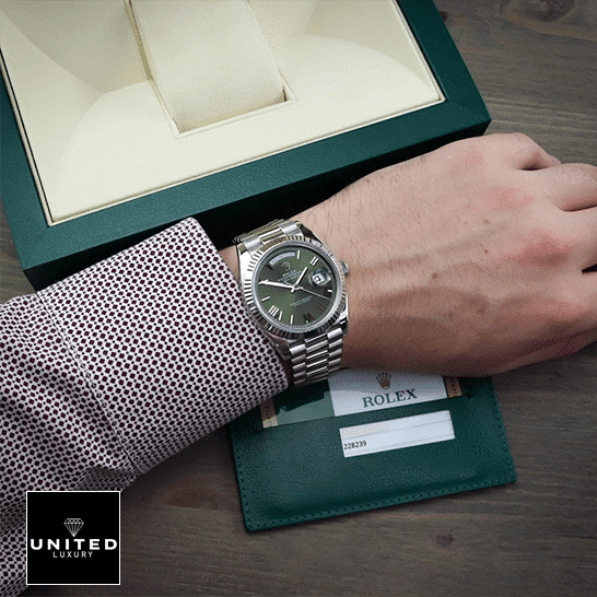 rolthtex Day-Date Olive Green 228239 Replica rolthtex Box in front of on is arm