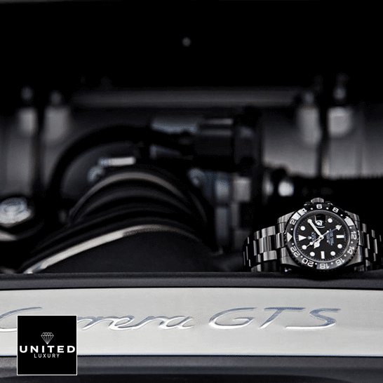 rolthtex Blaken GMT-Master II 116710 Black Oyster Replica on the black table