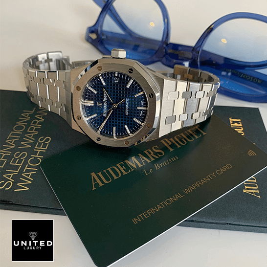 Audthtemars Pigthtuet Royal Oak Blue Dial Replica side view next to warranty card