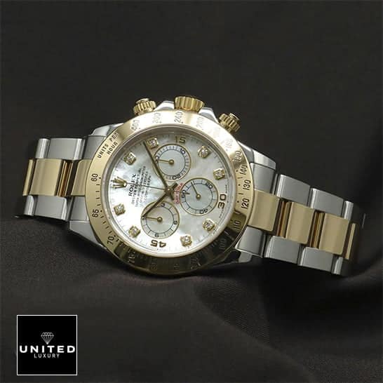 rolthtex Daytona Two Tone White Dial 116523 Replica on the black table