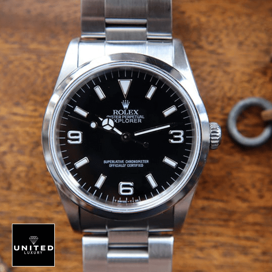 rolthtex Explorer 124270 Black Dial Replica on the brown Table