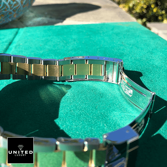 rolthtex Submariner 16613 Two Tone Stainless Steel Gold Diamond Replica on the table