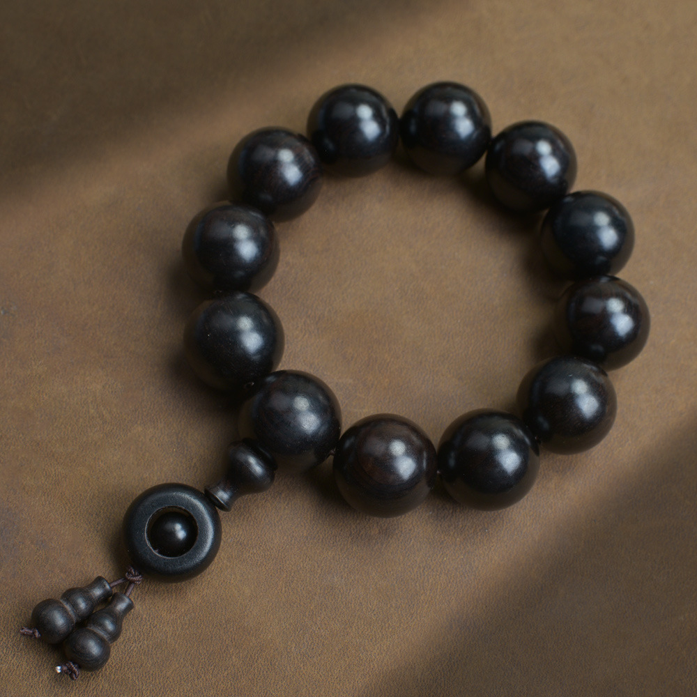 Selected Old Material Ebony Single Strand Bracelet