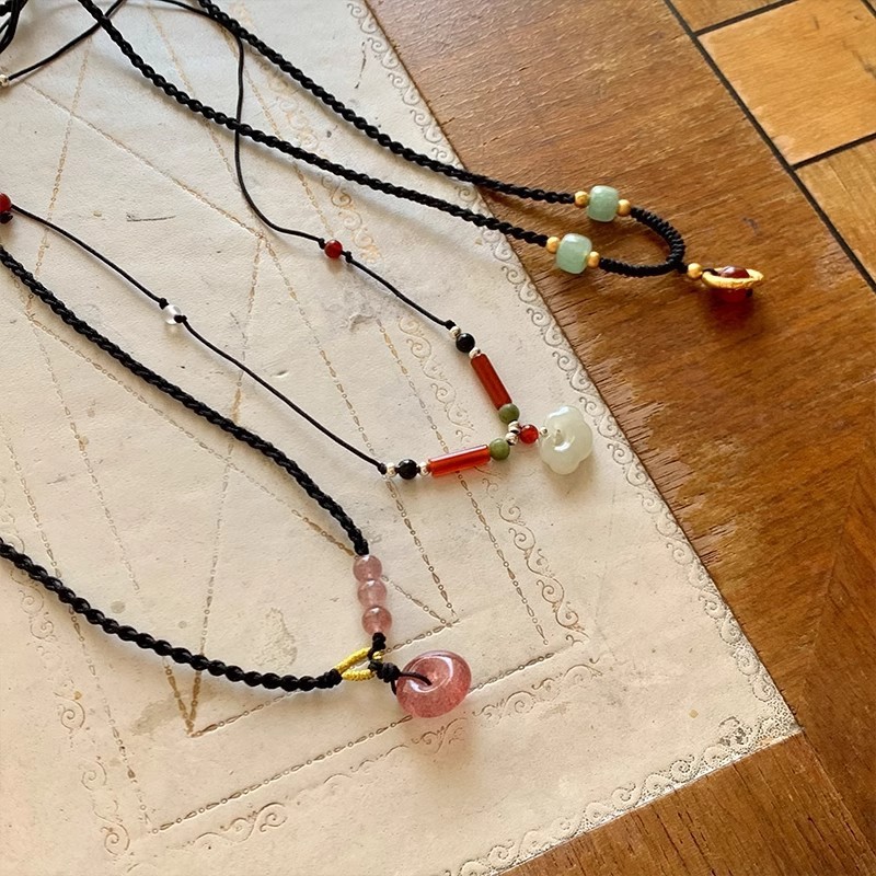 Black Cord as Paper, Gemstones as Ink—An Eastern Poem for the Neck