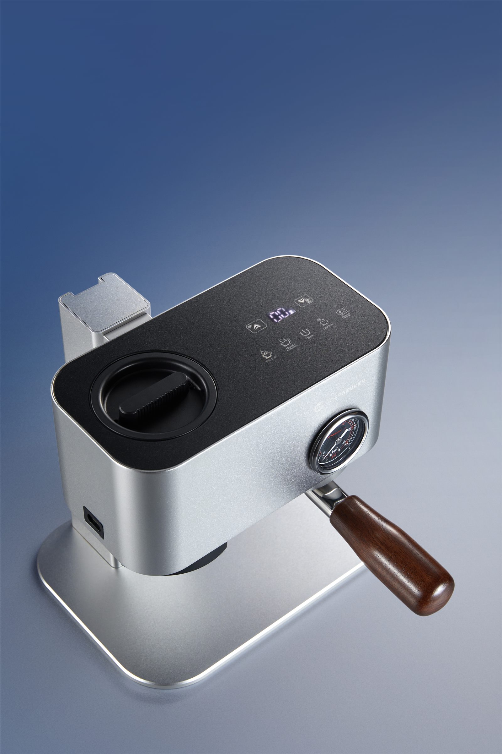 Top controls and pressure gauge on the silver Omni58X espresso machine
