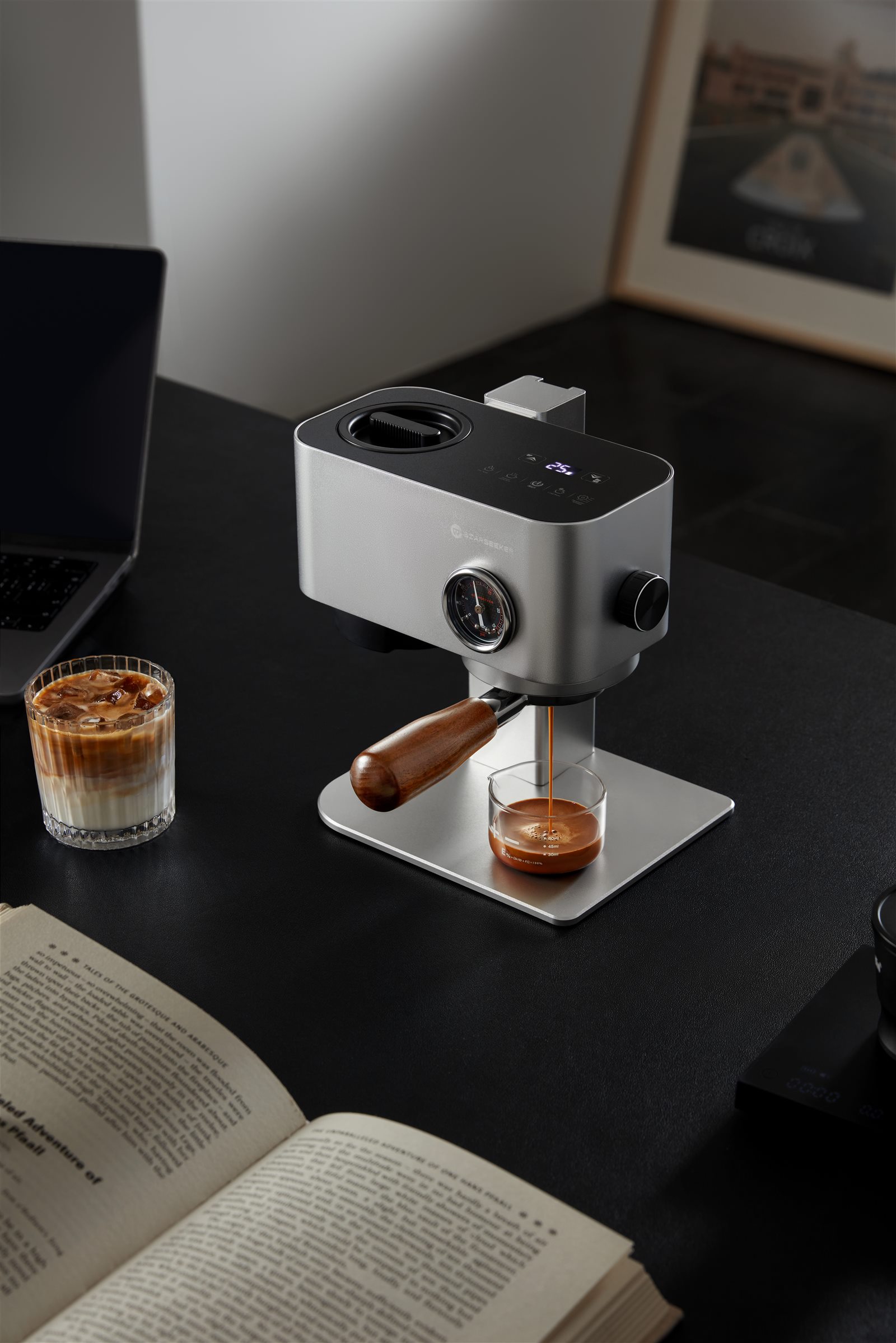 Silver Omni58X brewing espresso on a work desk