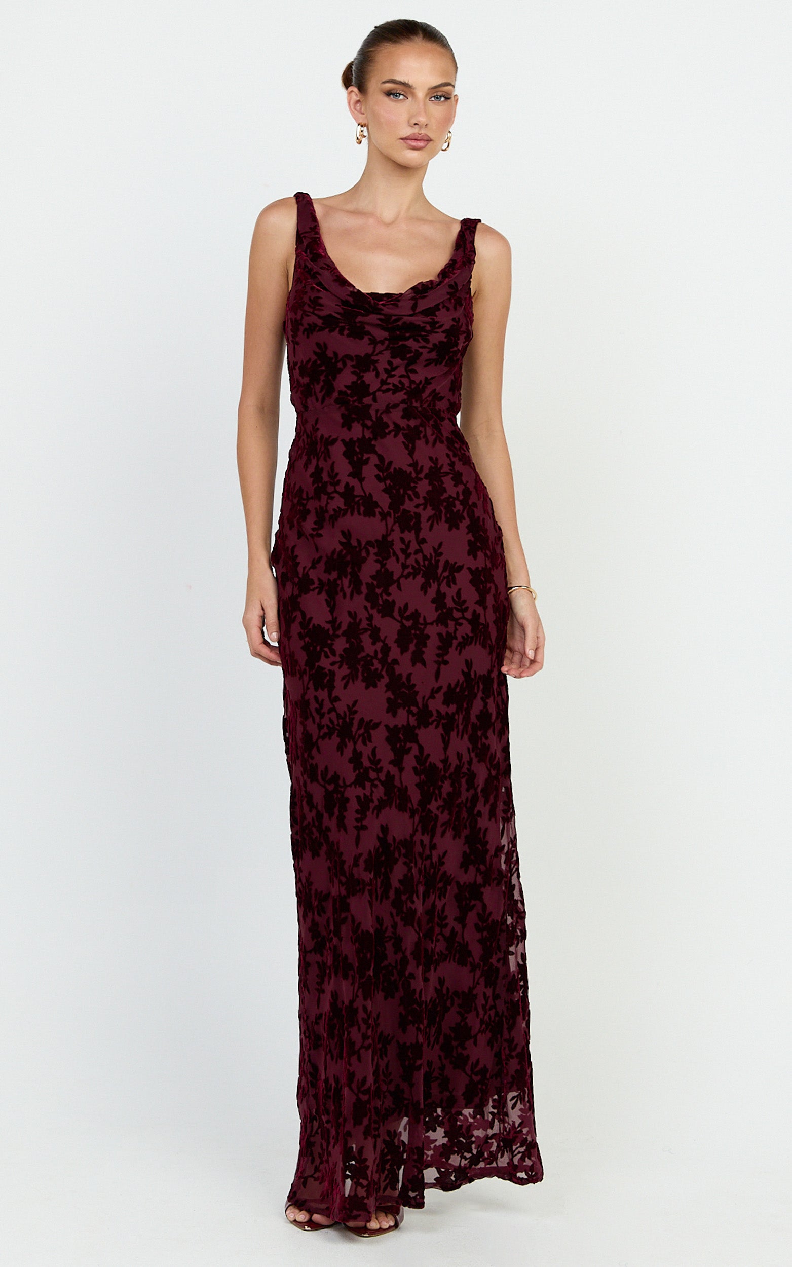 Model is wearing  cowl neck scooped back slip maxi dress in wine.