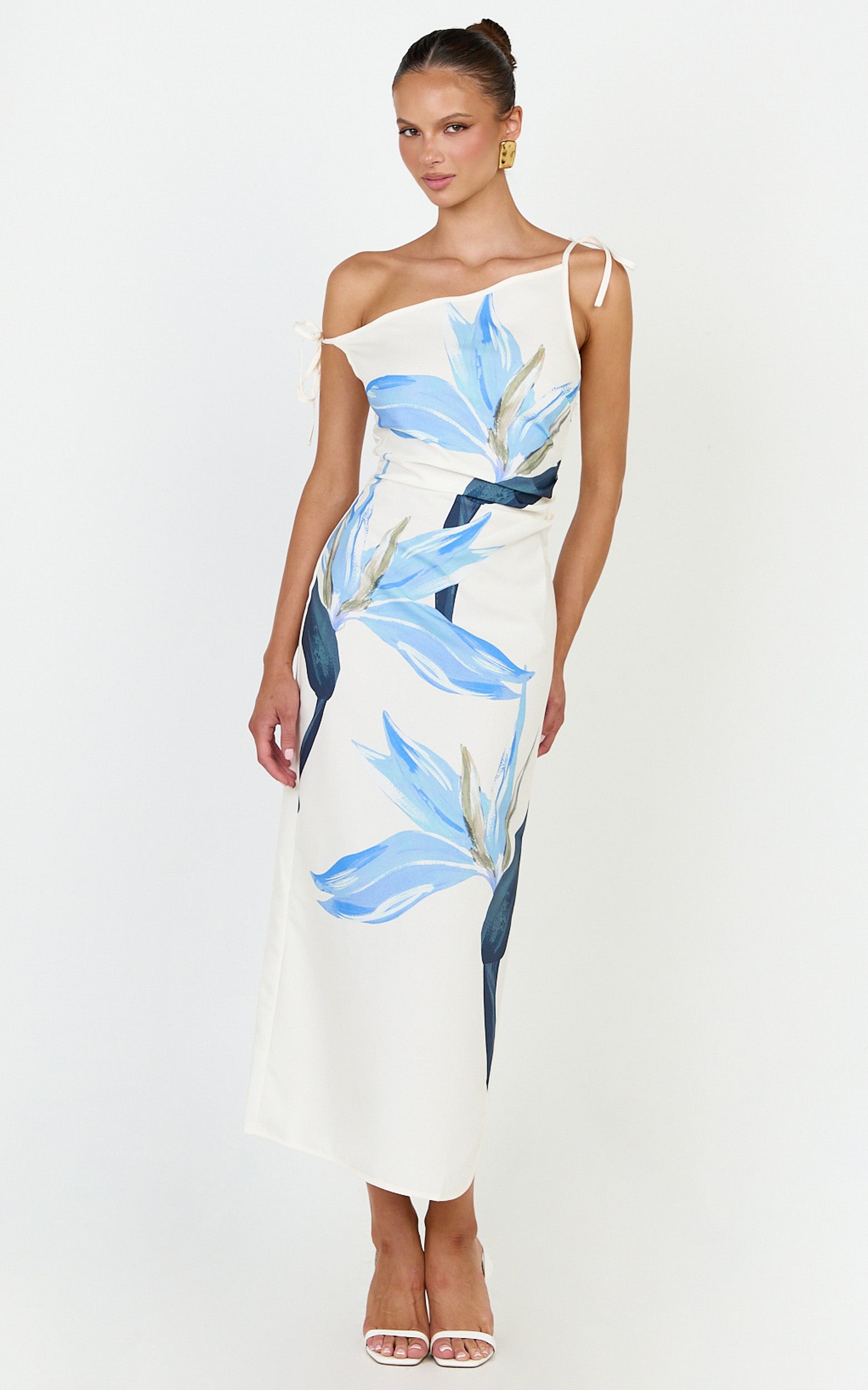 Model is wearing a off the shoulder side split column midi dress in zali floral print.