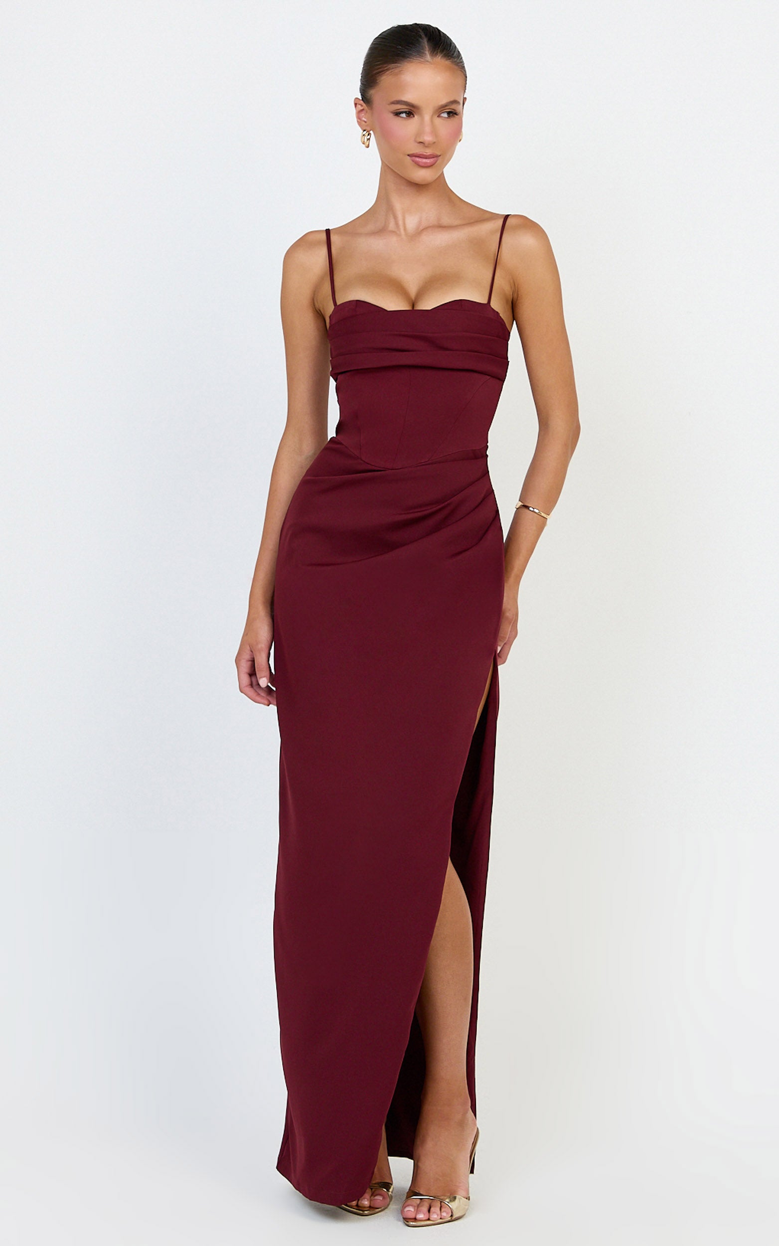 Model wearing a sweetheart neckline maxi dress in wine colour.