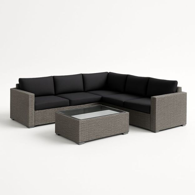 Divano angolare in rattan con cuscini neri e tavolino in vetro-Nestlivi