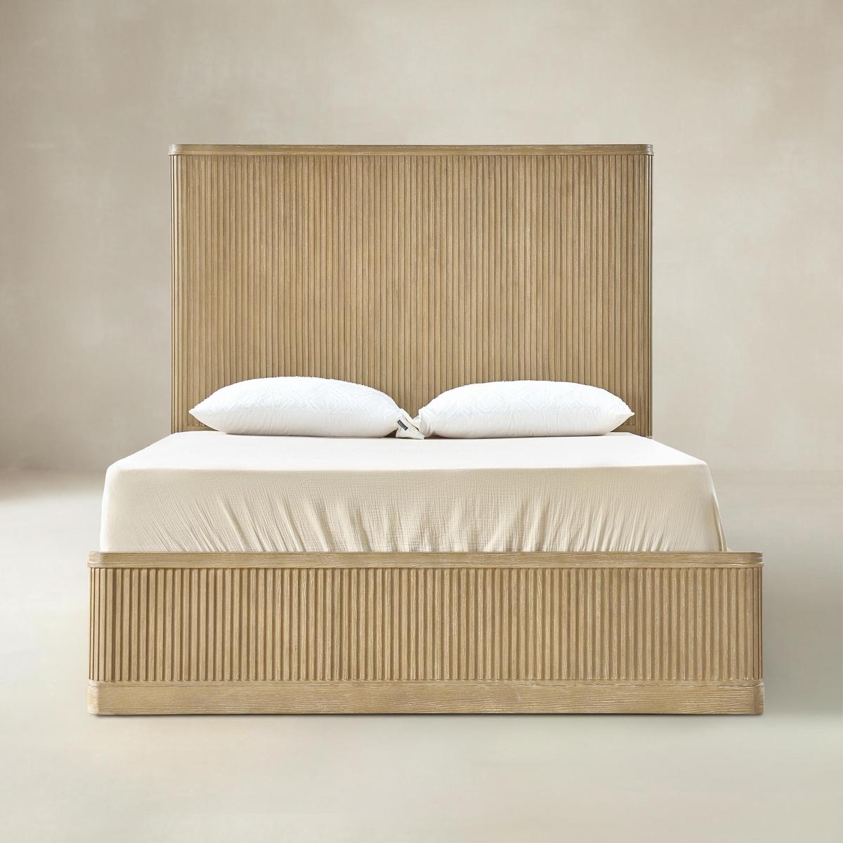 Joinery detail on natural fluted wood bed corner and side rail