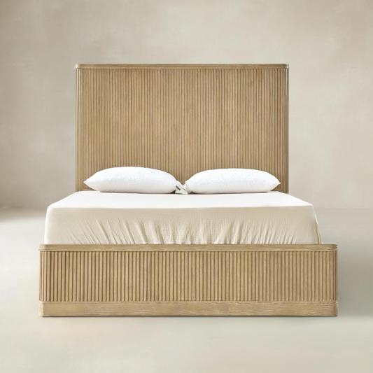 Joinery detail on natural fluted wood bed corner and side rail
