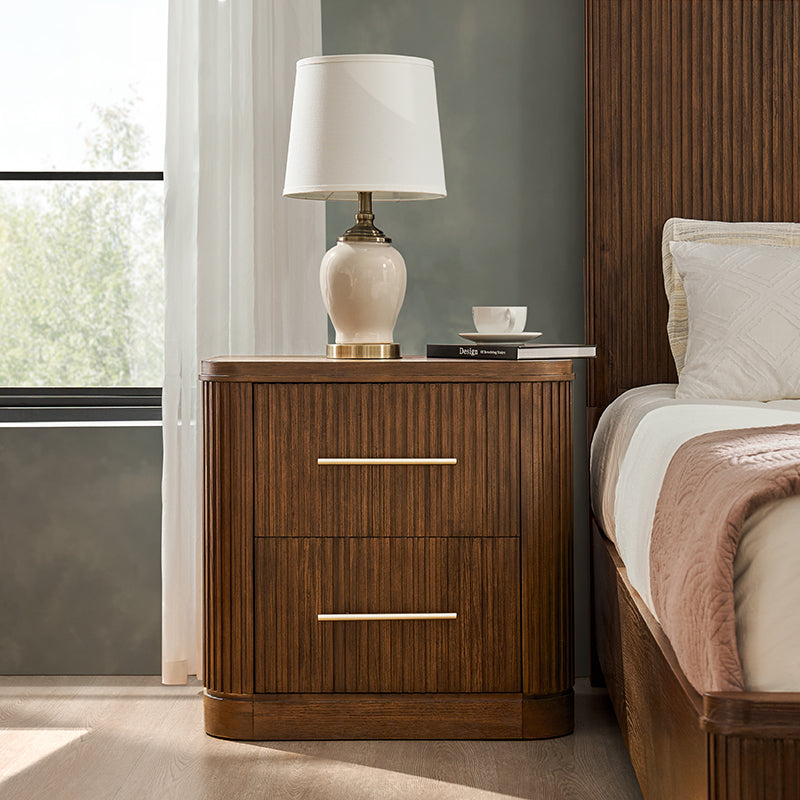 Fluted walnut nightstand with USB and Type-C charging beside matching bed