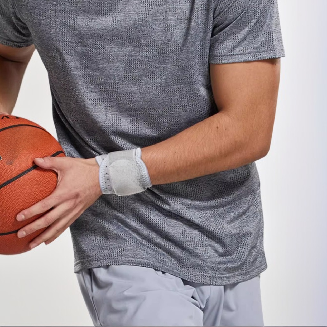 Athlete wearing compression wrist guard for protection