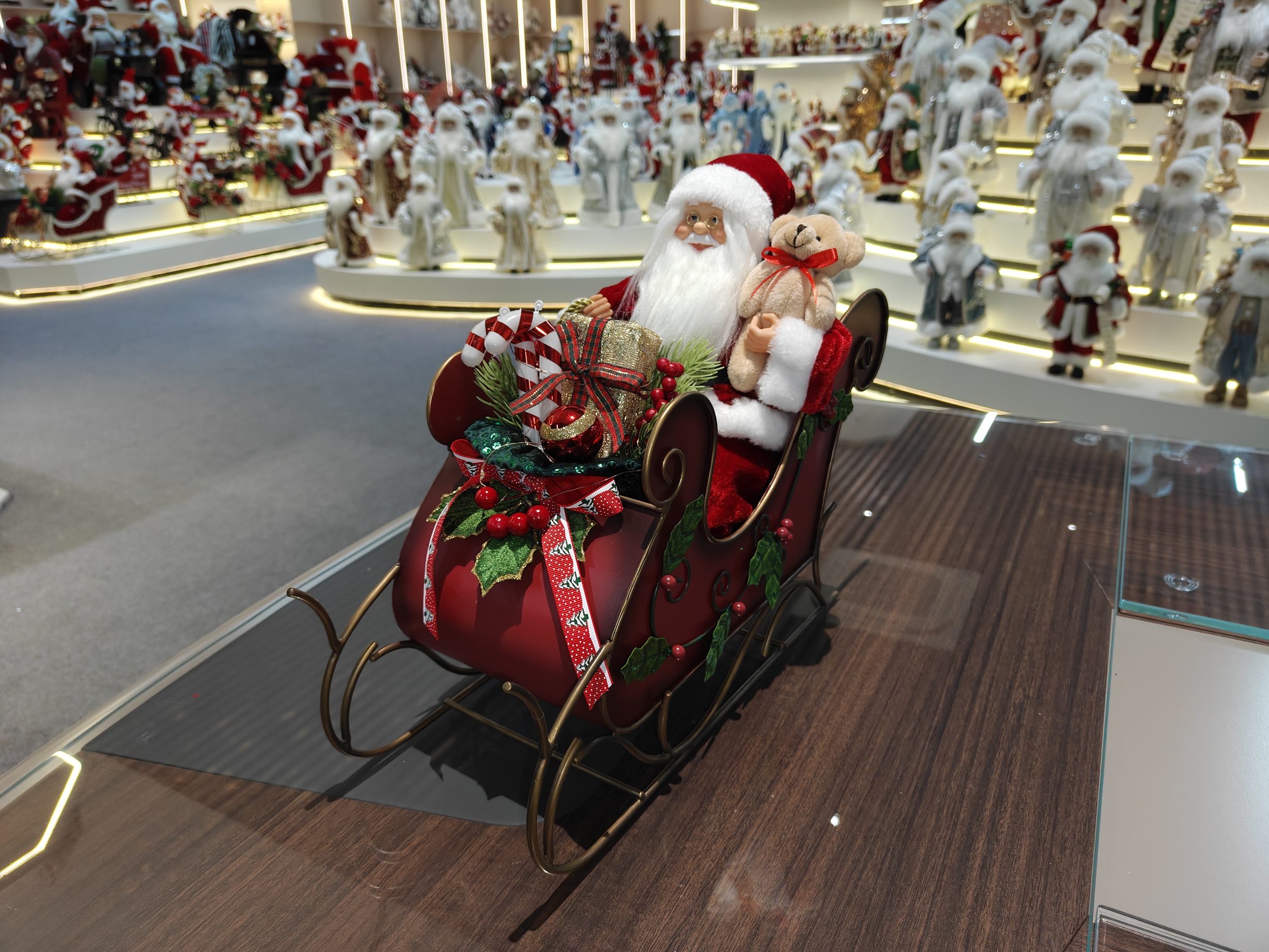 2027 New Classic Christmas Santa Doll Sitting on the Red&Green Sleigh with Music and Light Xmas Decorations Gifts Santa Claus