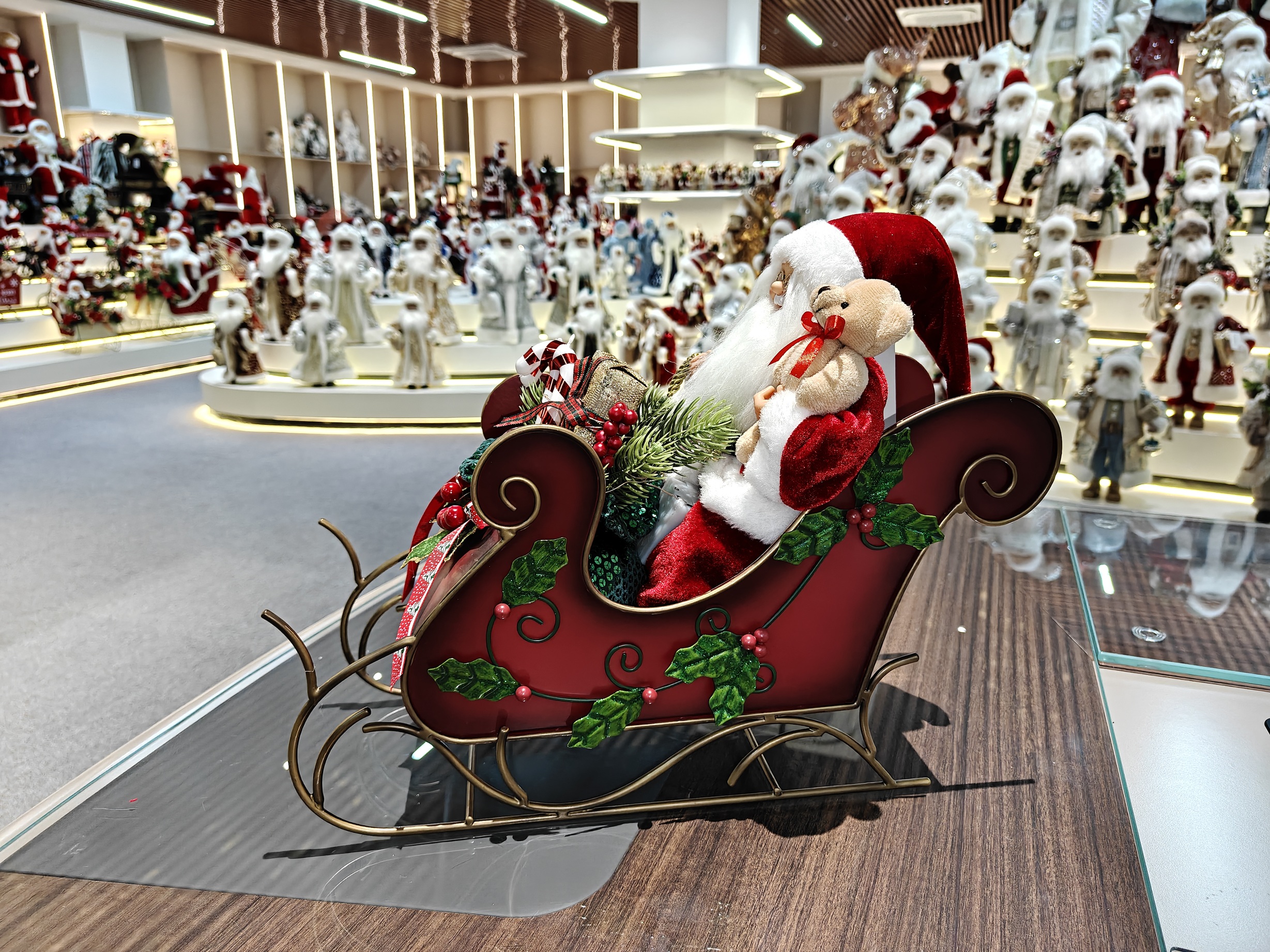 2027 New Classic Christmas Santa Doll Sitting on the Red&Green Sleigh with Music and Light Xmas Decorations Gifts Santa Claus