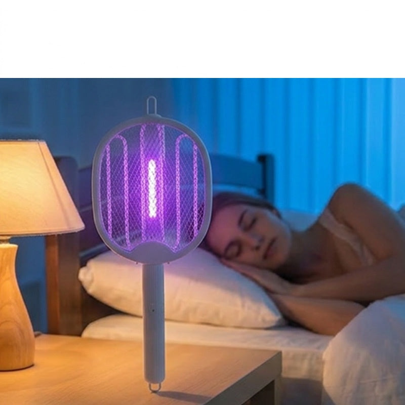50K+ SOLD! 🏆 2‑in‑1 Foldable Mosquito Swatter – Manual zap + UV auto trap. USB rechargeable, folds flat for storage. Sleep bite‑free tonight!