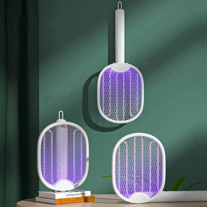 50K+ SOLD! 🏆 2‑in‑1 Foldable Mosquito Swatter – Manual zap + UV auto trap. USB rechargeable, folds flat for storage. Sleep bite‑free tonight!