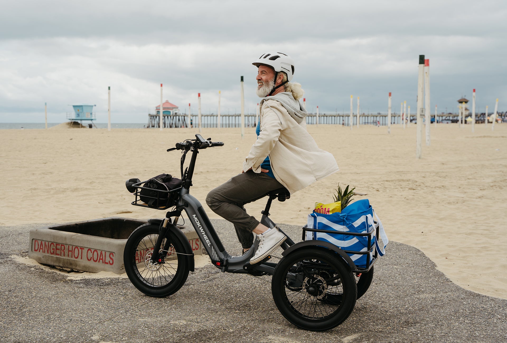 Mokwheel folding ebike with 80mm suspension fork and padded backrest saddle for a smooth, comfortable ride