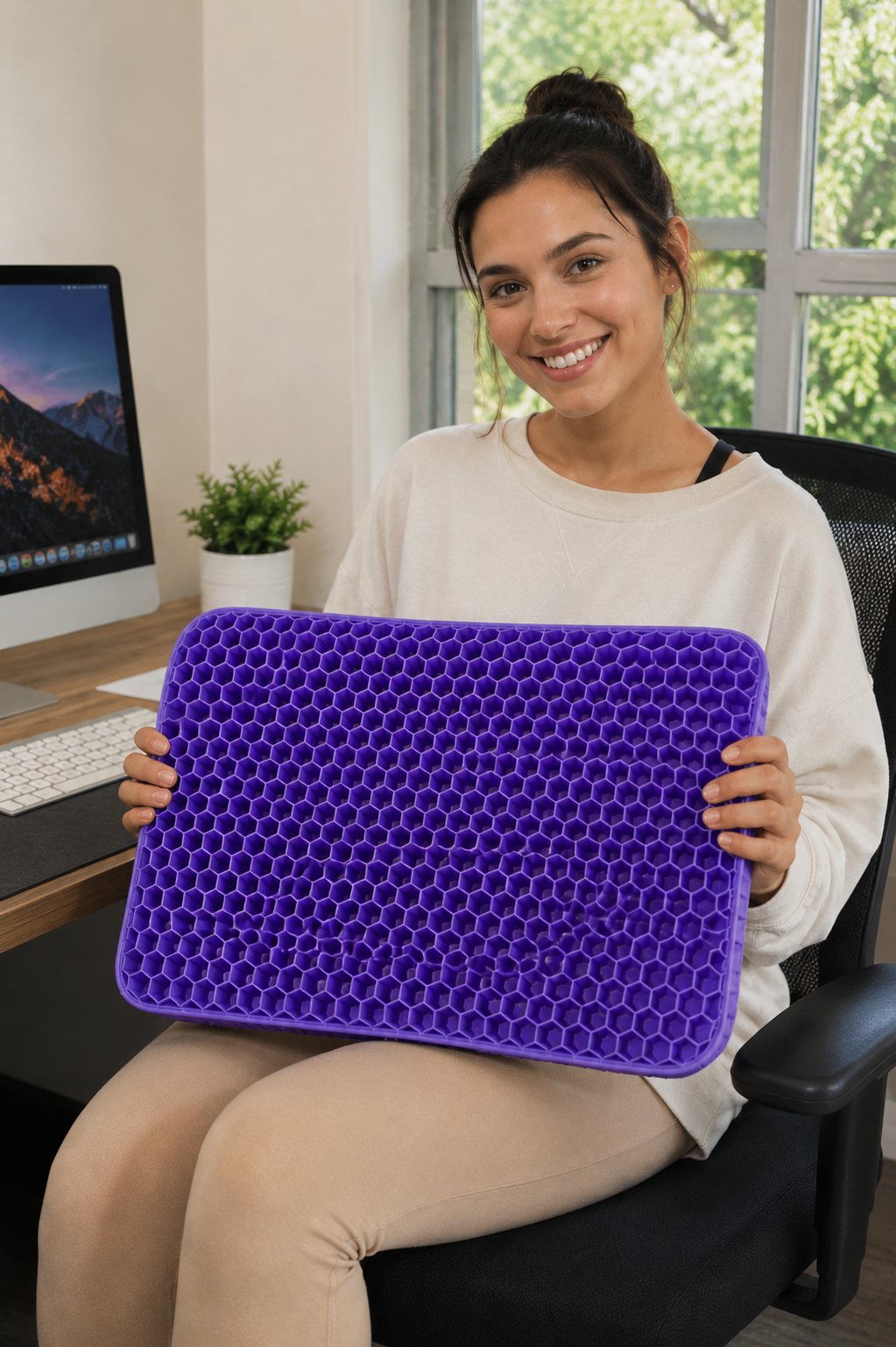 Image to replace: happy verified buyer using the silicone gel seat cushion on an office chair or car seat