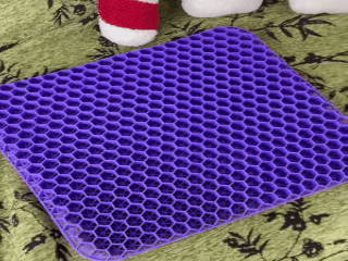 Hero image to replace: ergonomic silicone gel seat cushion on an office chair, showing blue or purple honeycomb cooling design