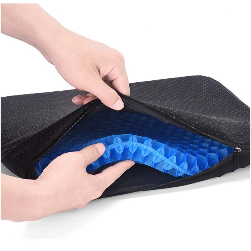 Image to replace: non-slip washable zippered cover being removed from the silicone gel cushion for cleaning