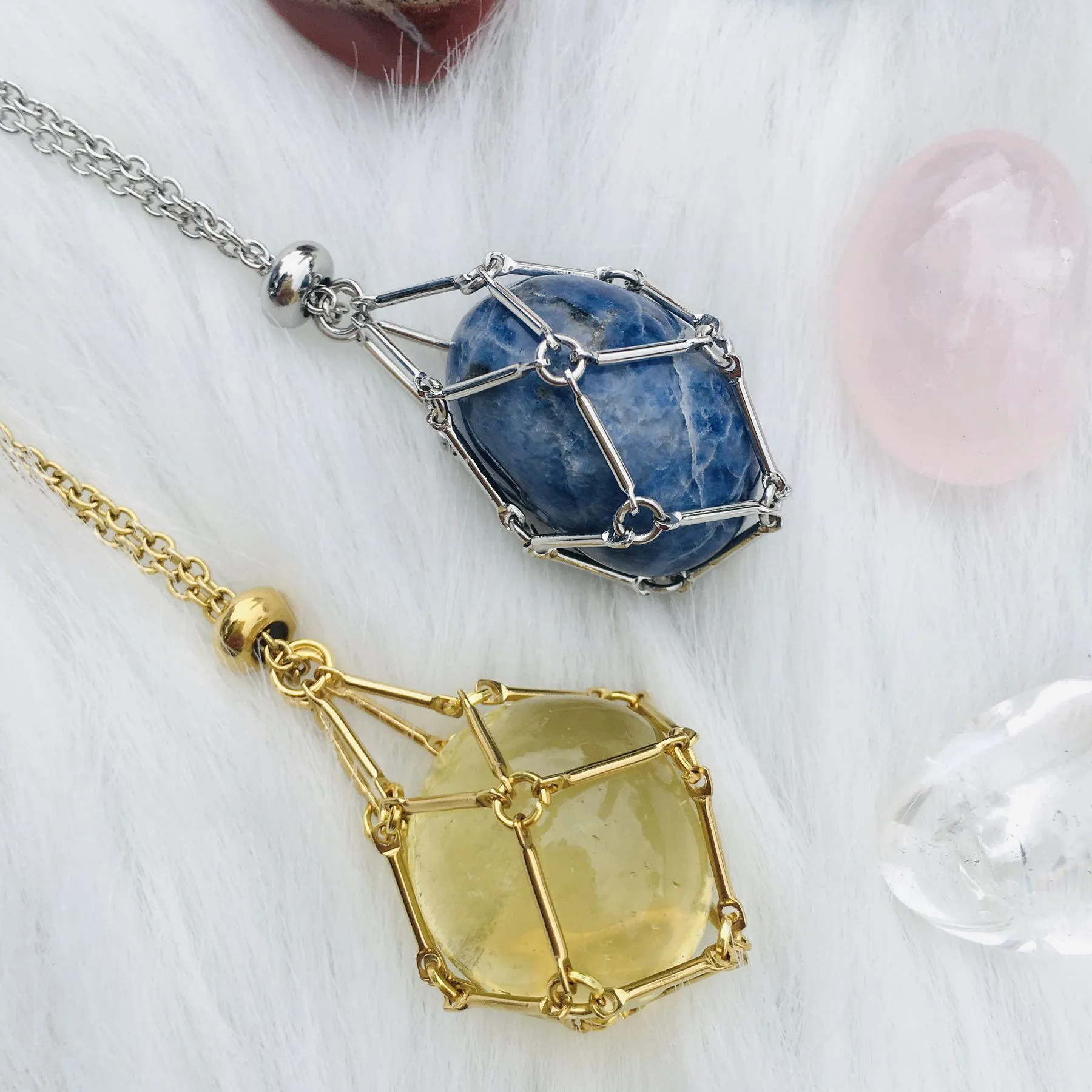 Close-up of crystal holder necklaces with natural stones