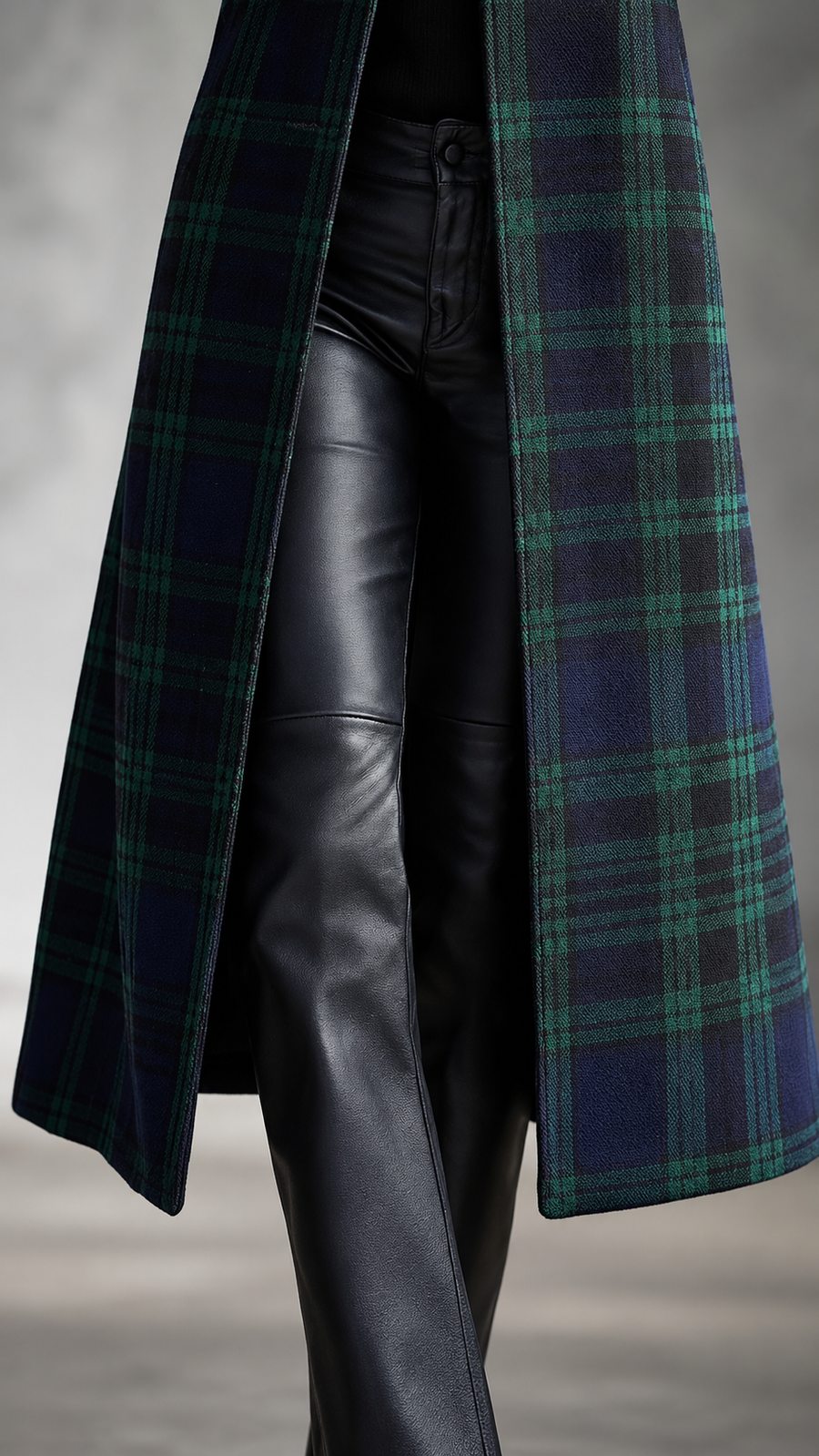 Longline hem and elongated plaid panels of the coat