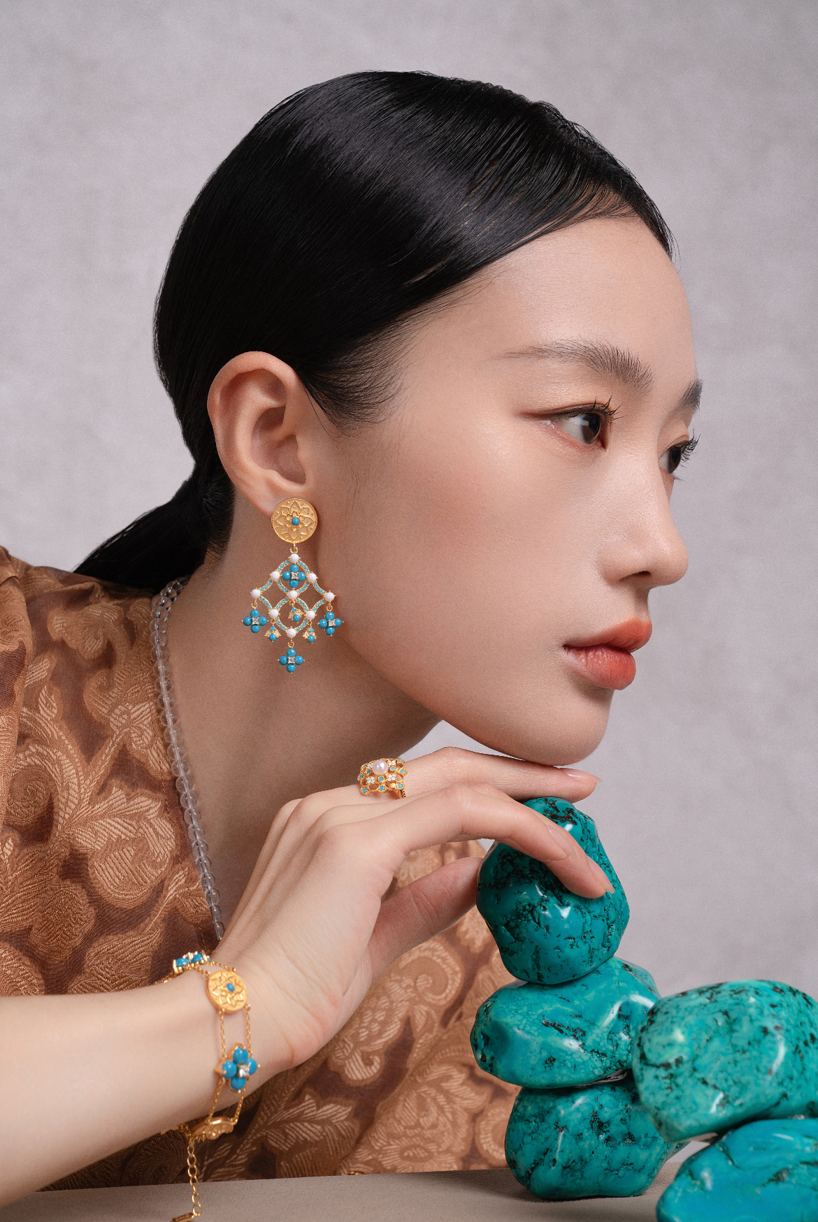 {"default":"\"Women empowering with ethical handcrafted turquoise necklace in spiritual harmony\""}
