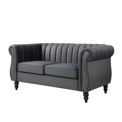 Canapé deux places en similicuir gris avec clous