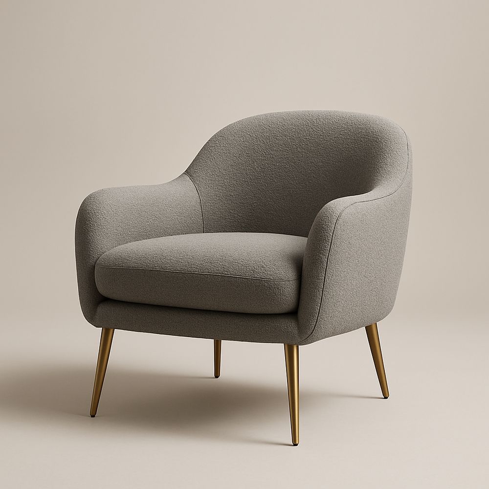 Poltrona in tessuto grigio con gambe in metallo dorato