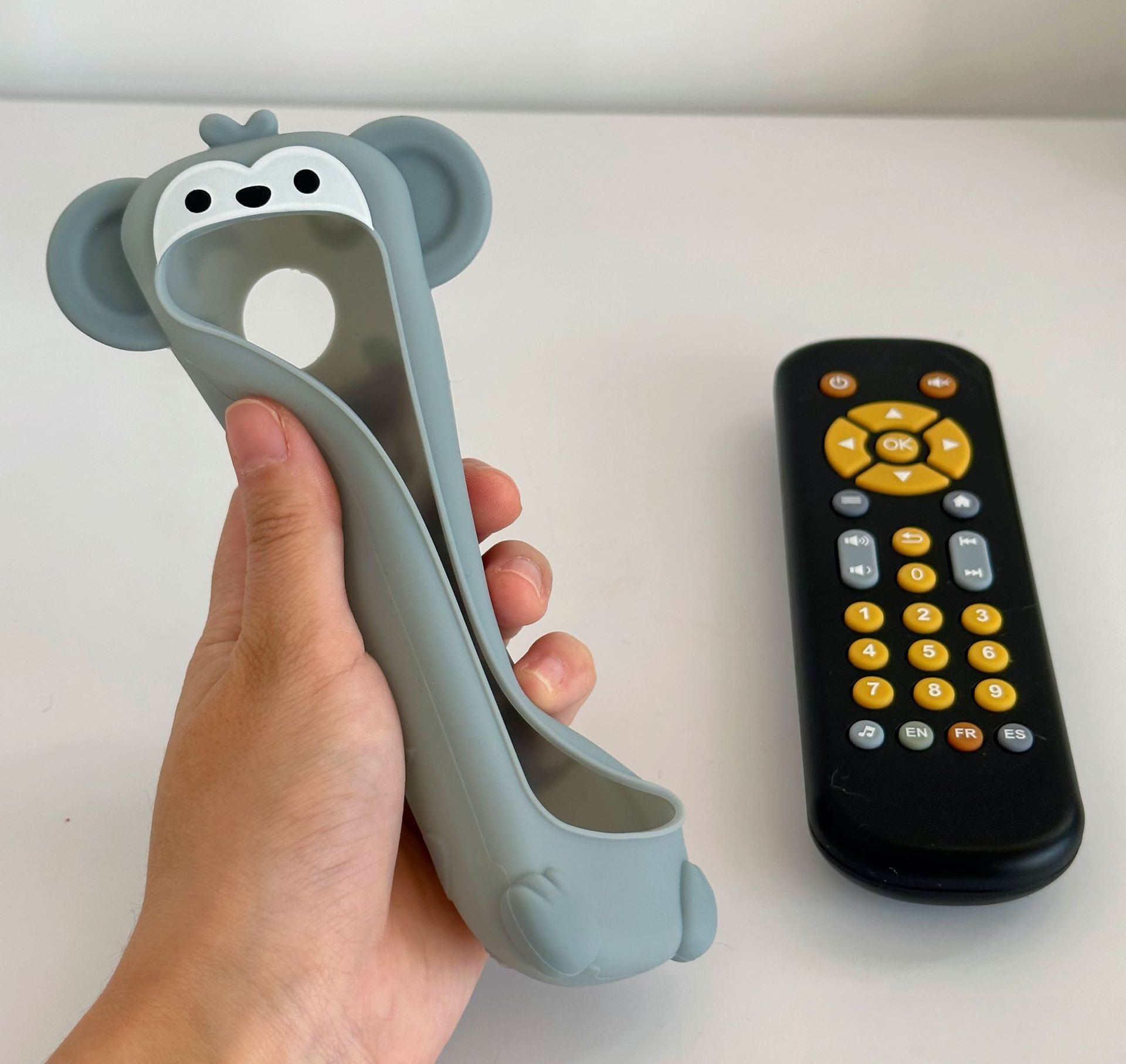 A simulated TV remote control that supports early childhood education in English, French, and Spanish