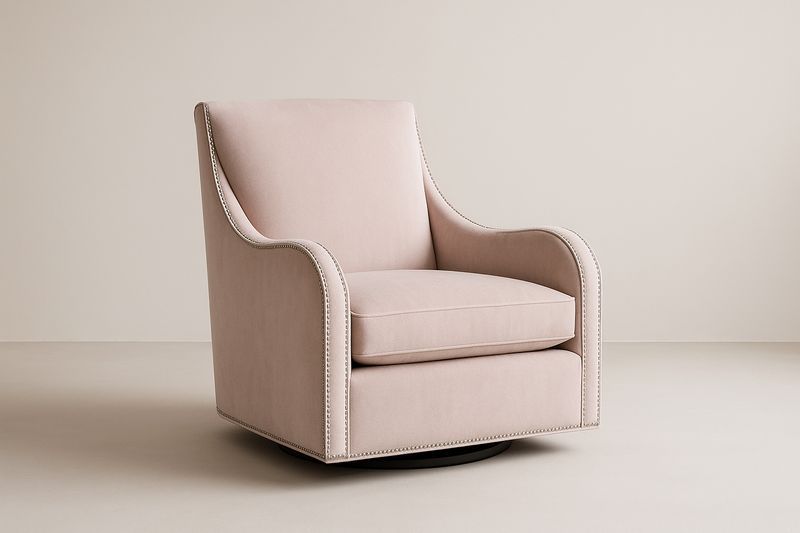 Fauteuil pivotant en velours rose avec clous de tapissier