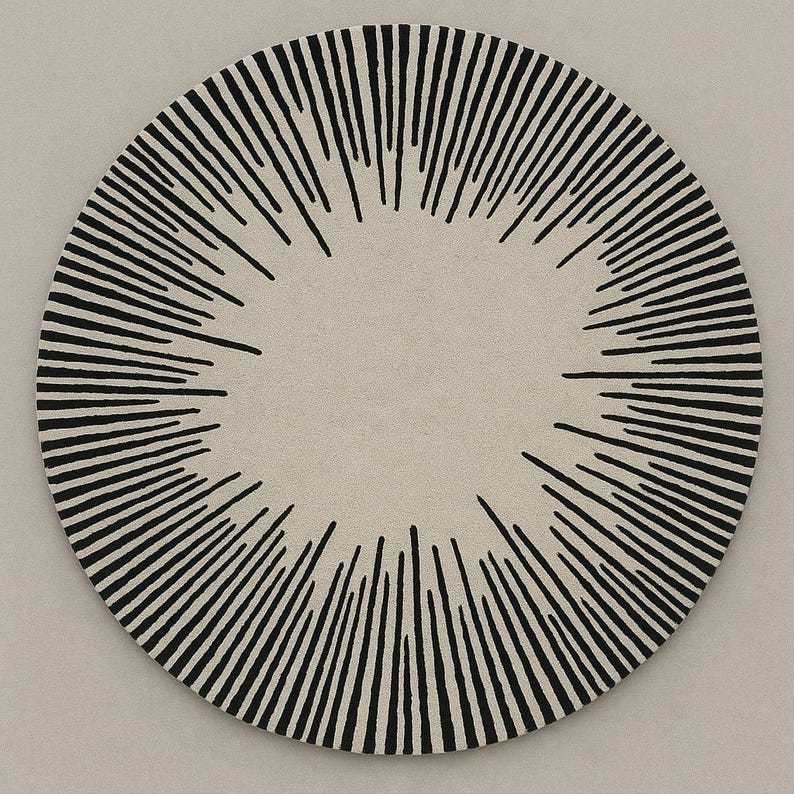 Tapis rond laine noir et blanc motif solaire