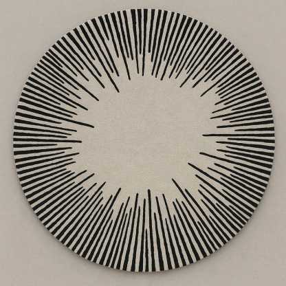 Tapis rond laine noir et blanc motif solaire