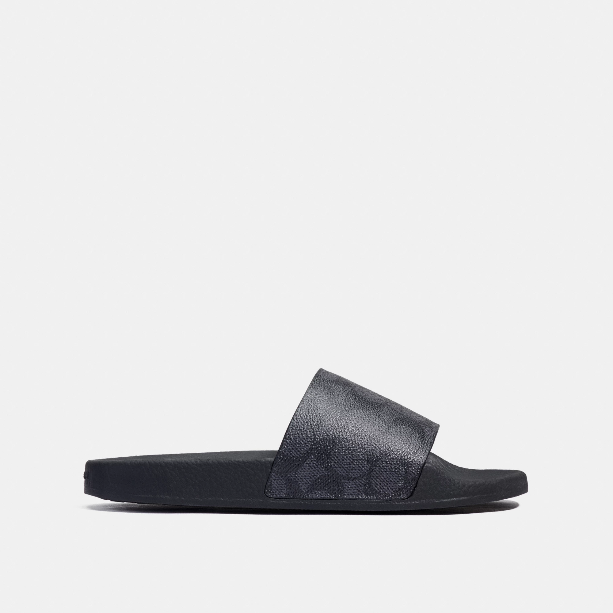 COACH®,Udele Sport Slide In Signature Canvas,Canvas,Rubber,EVA,Slides,Logo,Pull Tab,Cushioned Outsole,Casual,Black,Angle View