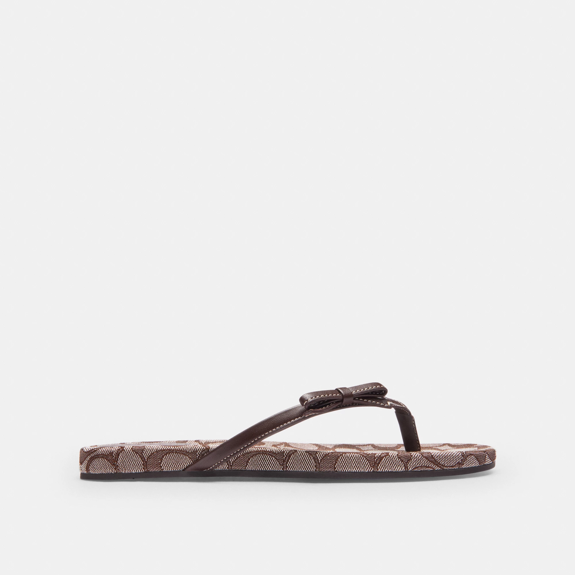 COACH®,Bow Flip Flop In Signature Jacquard,Brown,Angle View