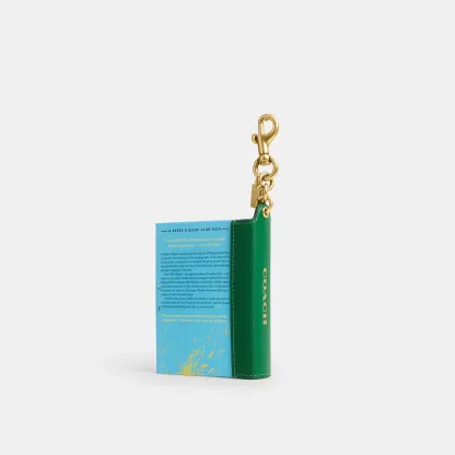 COACH®,Little Fires Everywhere By Celeste Ng Book Bag Charm,Bag Charm,Metal Material,3D Embellishment,Color Block,Logo,Multi Color,Back View